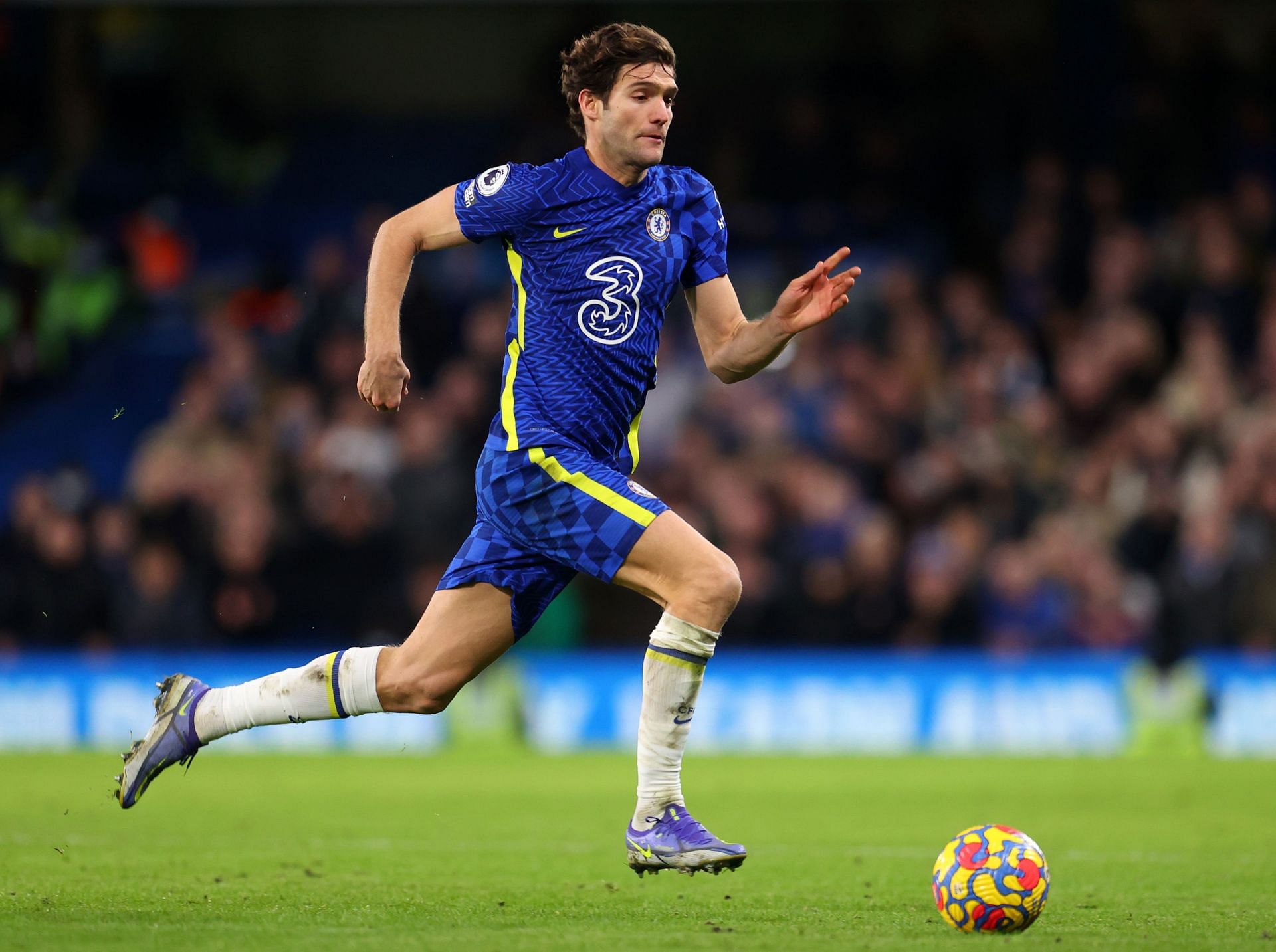 Marcos Alonso drives forward against Liverpool.