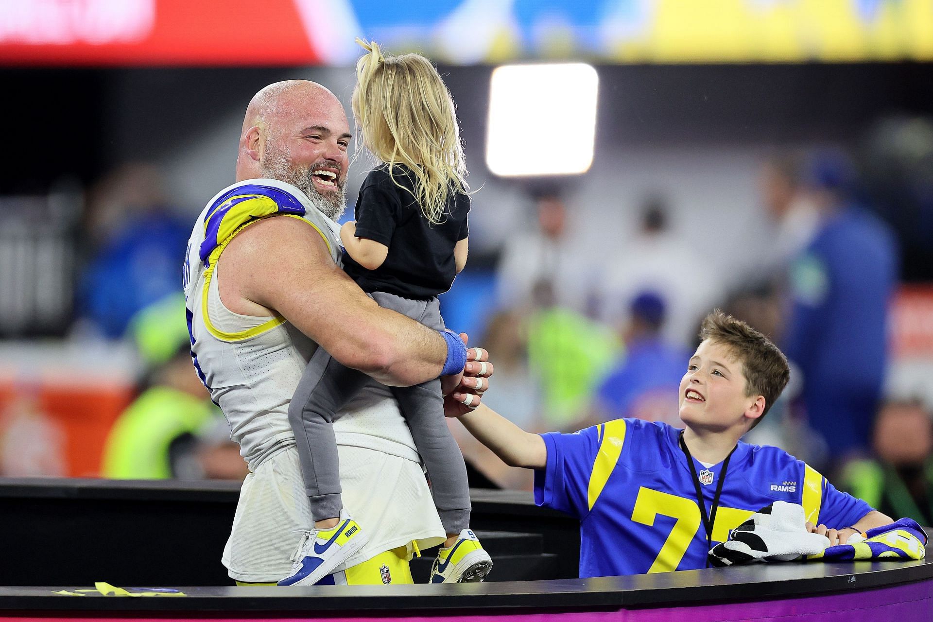 Los Angeles Rams OT Andrew Whitworth celebrating his with his kids after Super Bowl LVI