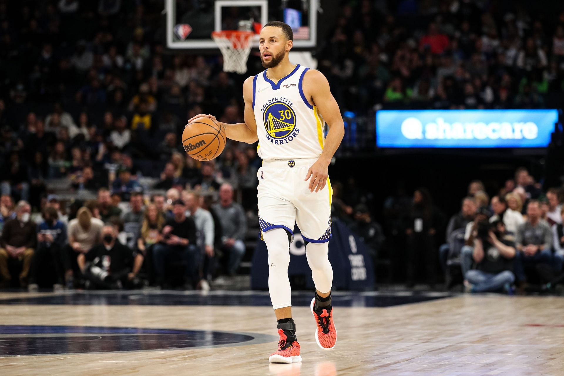 Golden State Warriors talisman Steph Curry dribbling the ball up the court against the Minnesota Timberwolves.