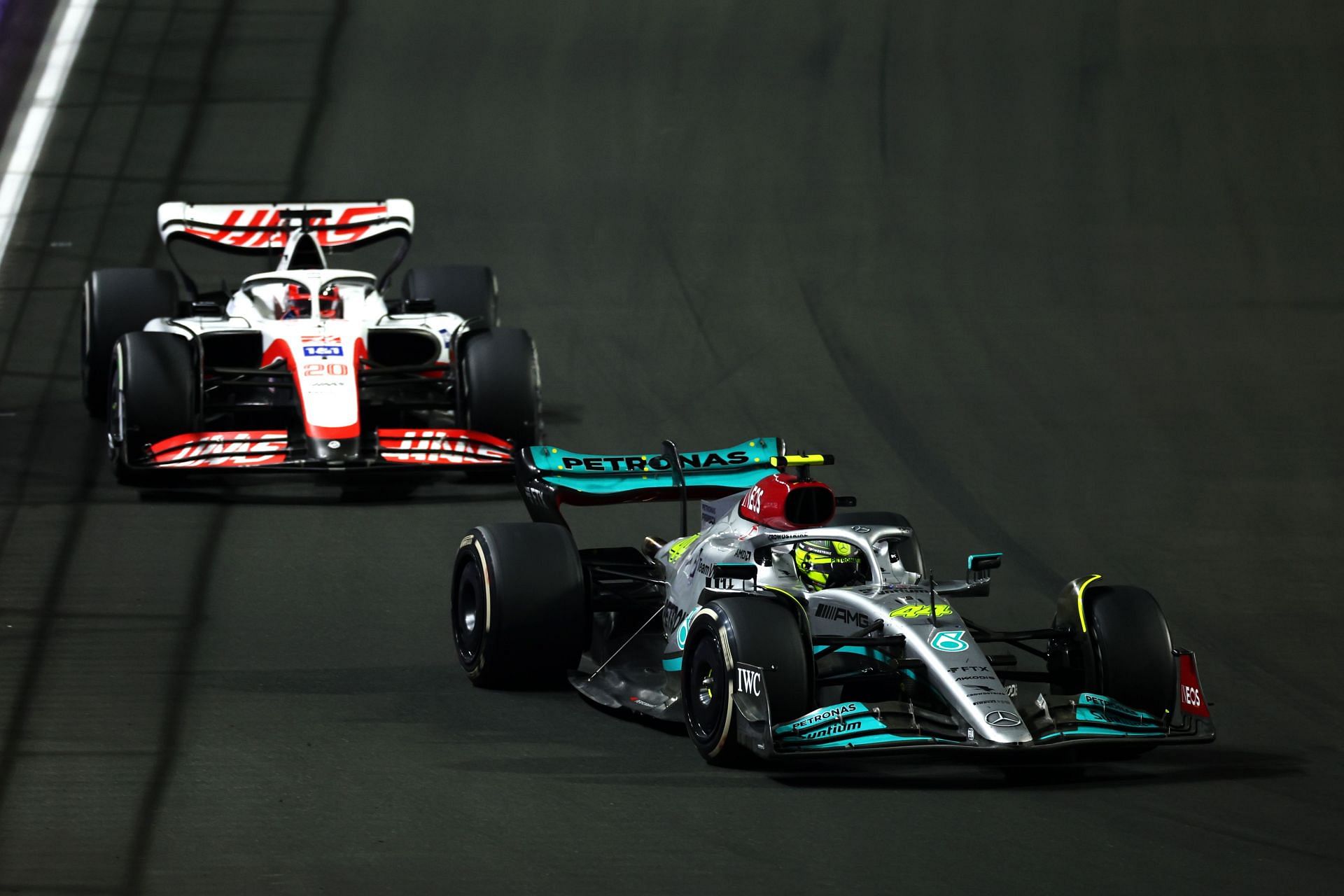 Mercedes&#039; Lewis Hamilton (foreground) being followed by Haas F1&#039;s Kevin Magnussen around the Jeddah Corniche Circuit (Photo by Lars Baron/Getty Images)