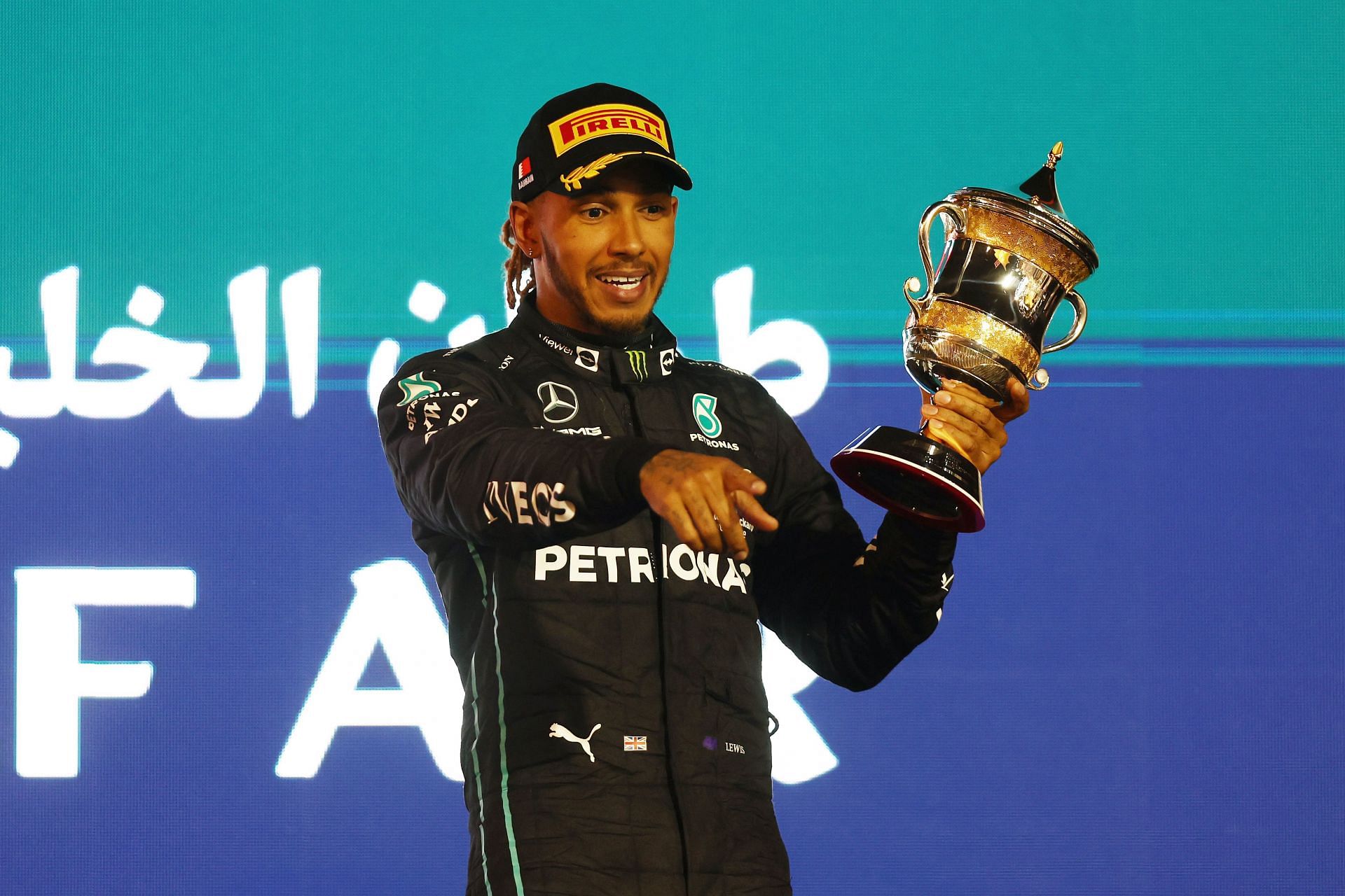 Lewis Hamilton on 3rd place podium at Bahrain Grand Prix 2022. (Image via Lars Baron/Getty Images)
