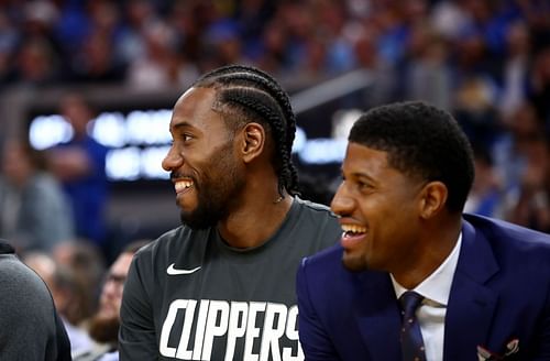 Kawhi Leonard and Paul George on the bench during the Los Angeles Clippers games v Golden State Warriors