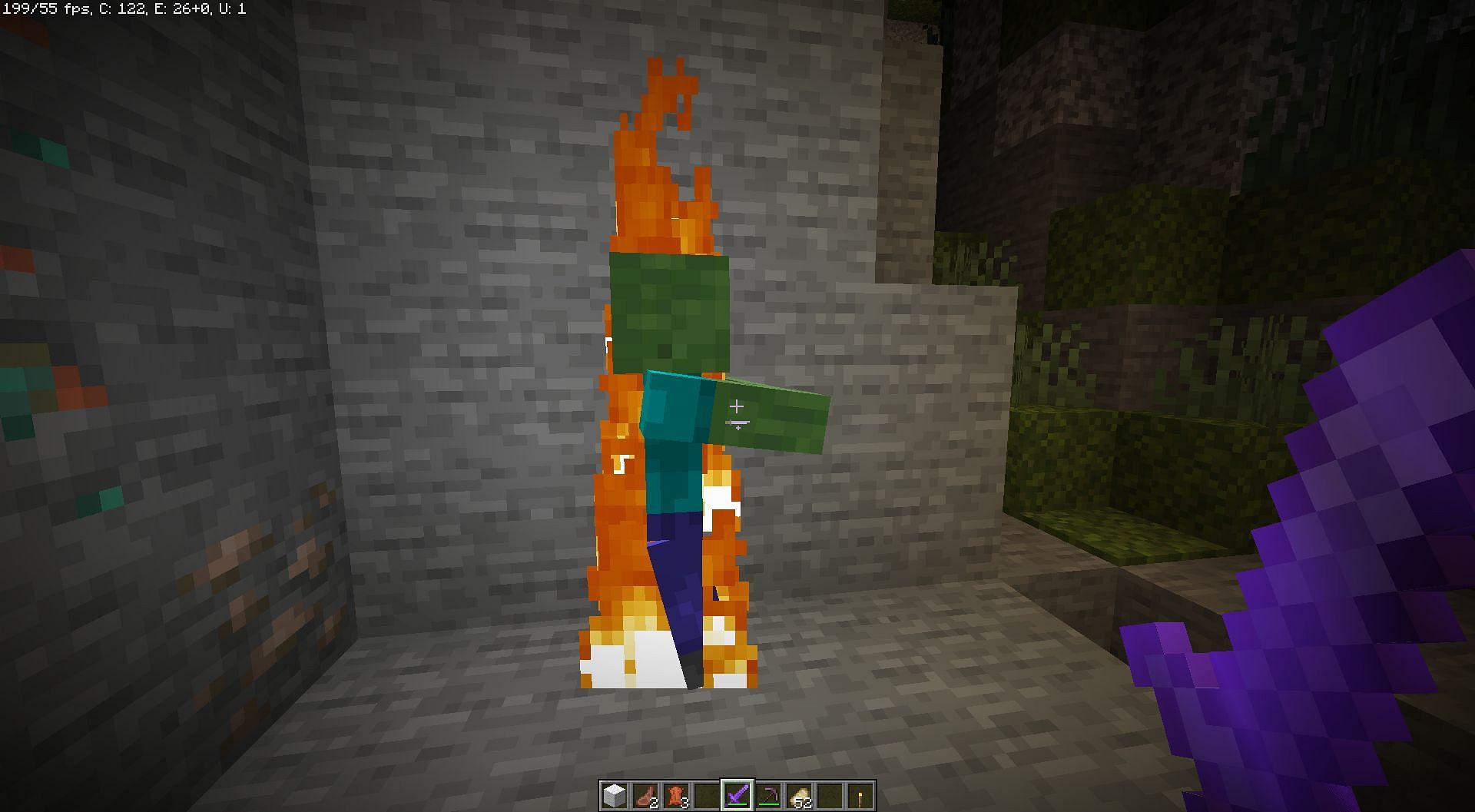 A zombie on fire from the sword (Image via Minecraft)