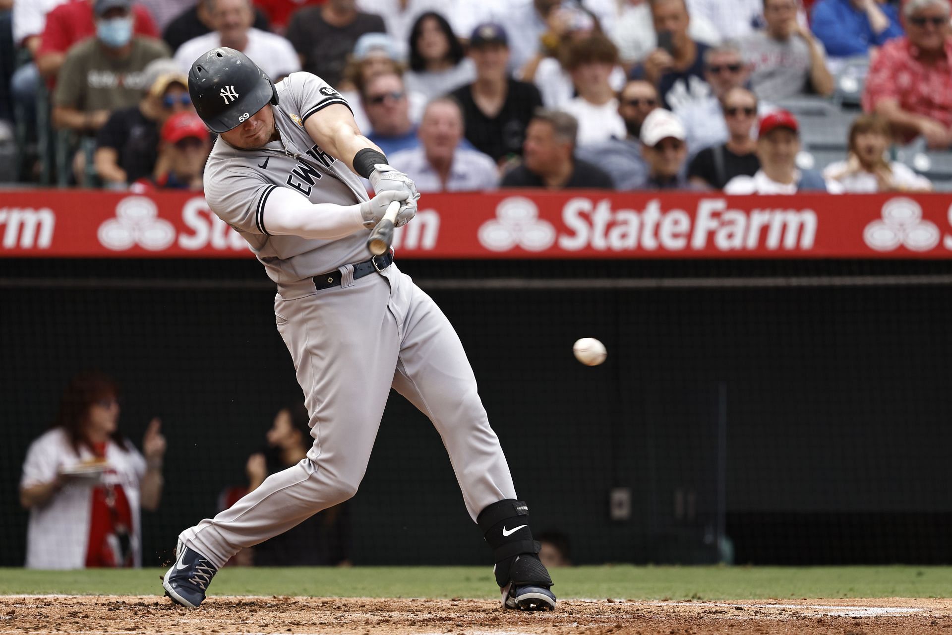 Luke Voit swings at a pitch during a New York Yankees v Los Angeles Angels game