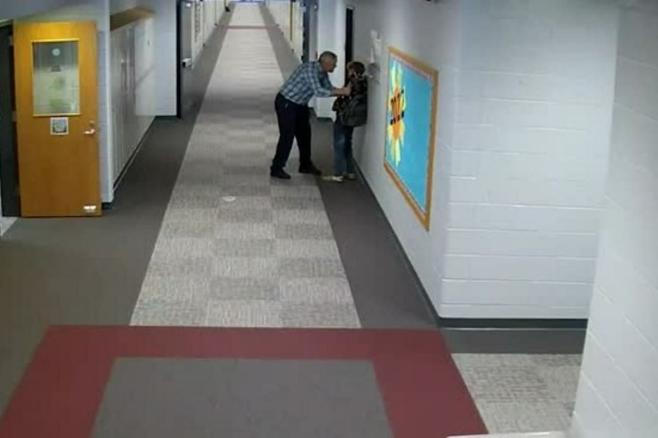 Camera footage showing teacher slamming a student against the wall before slapping him (Image via Buago Community Schools)
