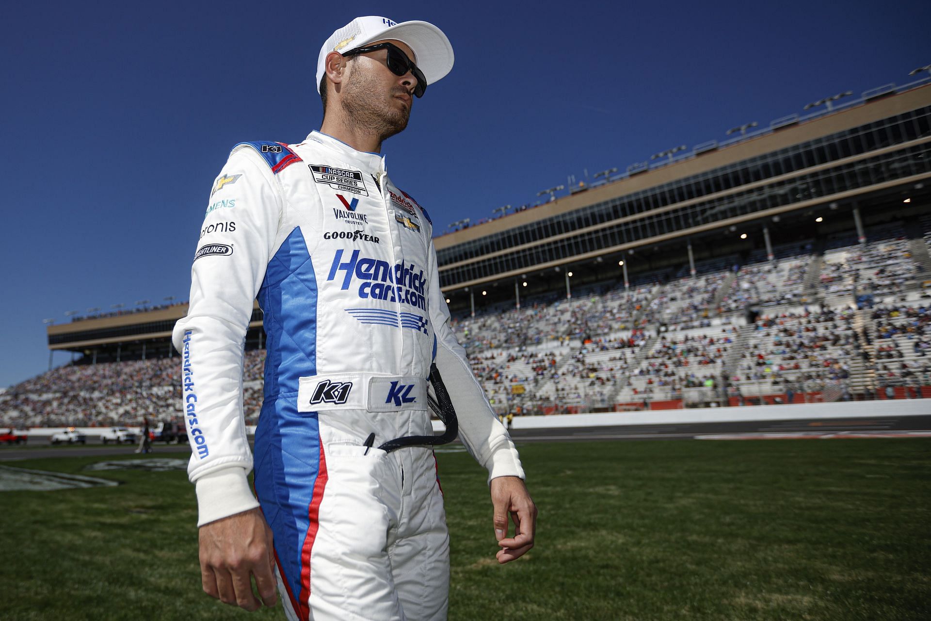 Kyle Larson walks prior to the NASCAR Cup Series Folds of Honor QuikTrip 500.