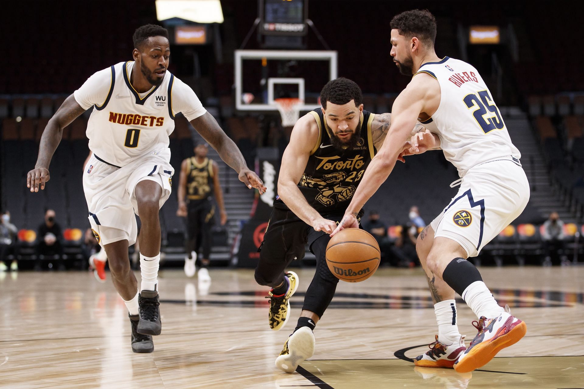 Fred VanVleet (C) of the Toronto Raptors vs Denver Nuggets.