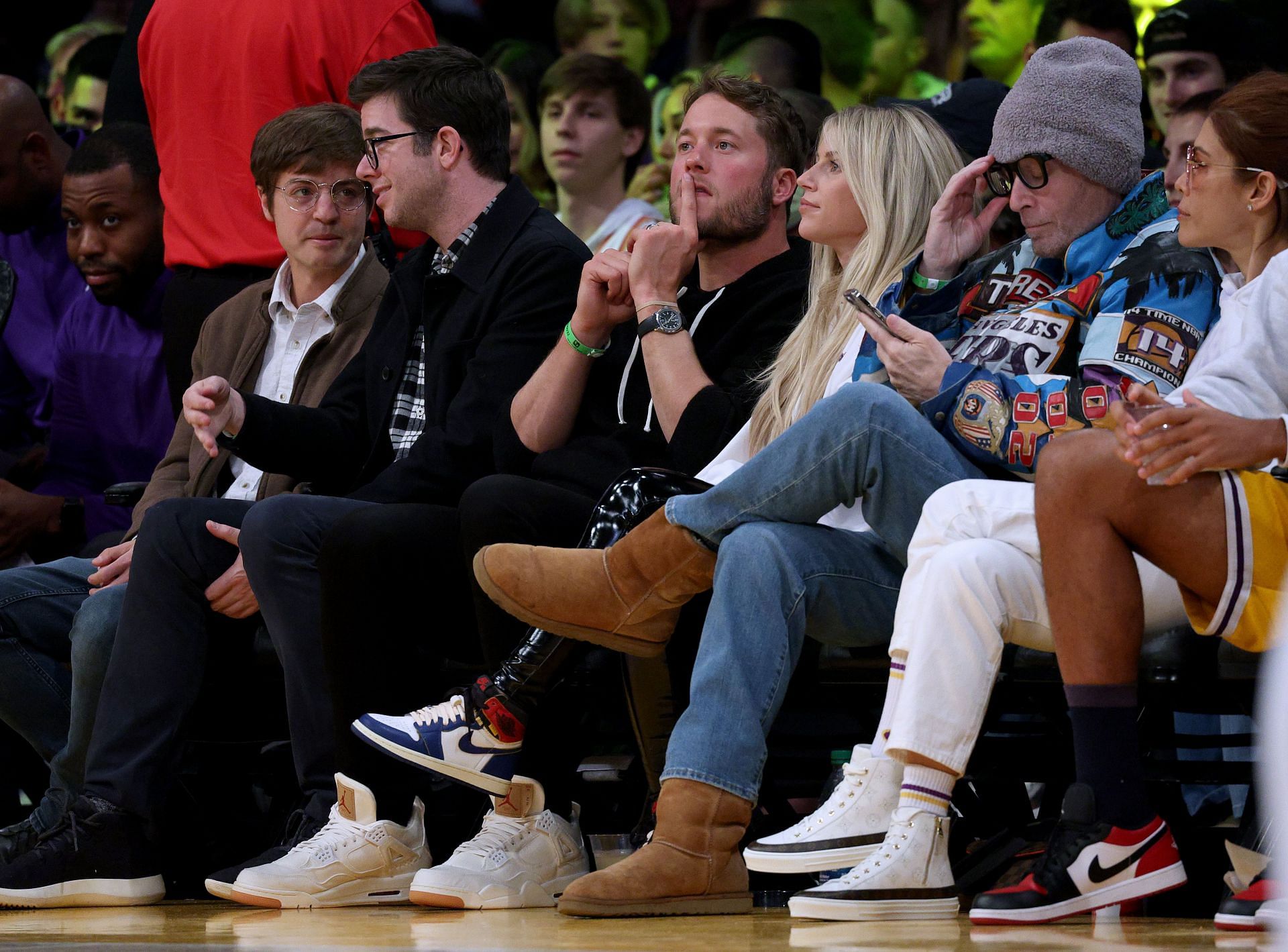 Kelly and Matthew Stafford on courtside for an NBA game