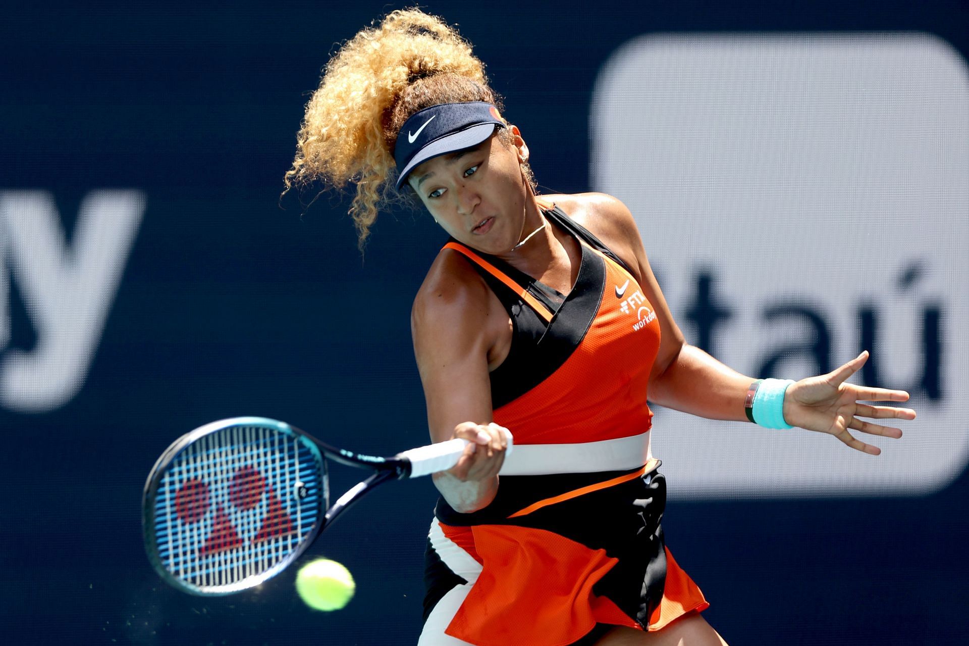 Naomi Osaka of Japan returns a shot to Iga Swiatek of Poland during the women's final of the Miami Open