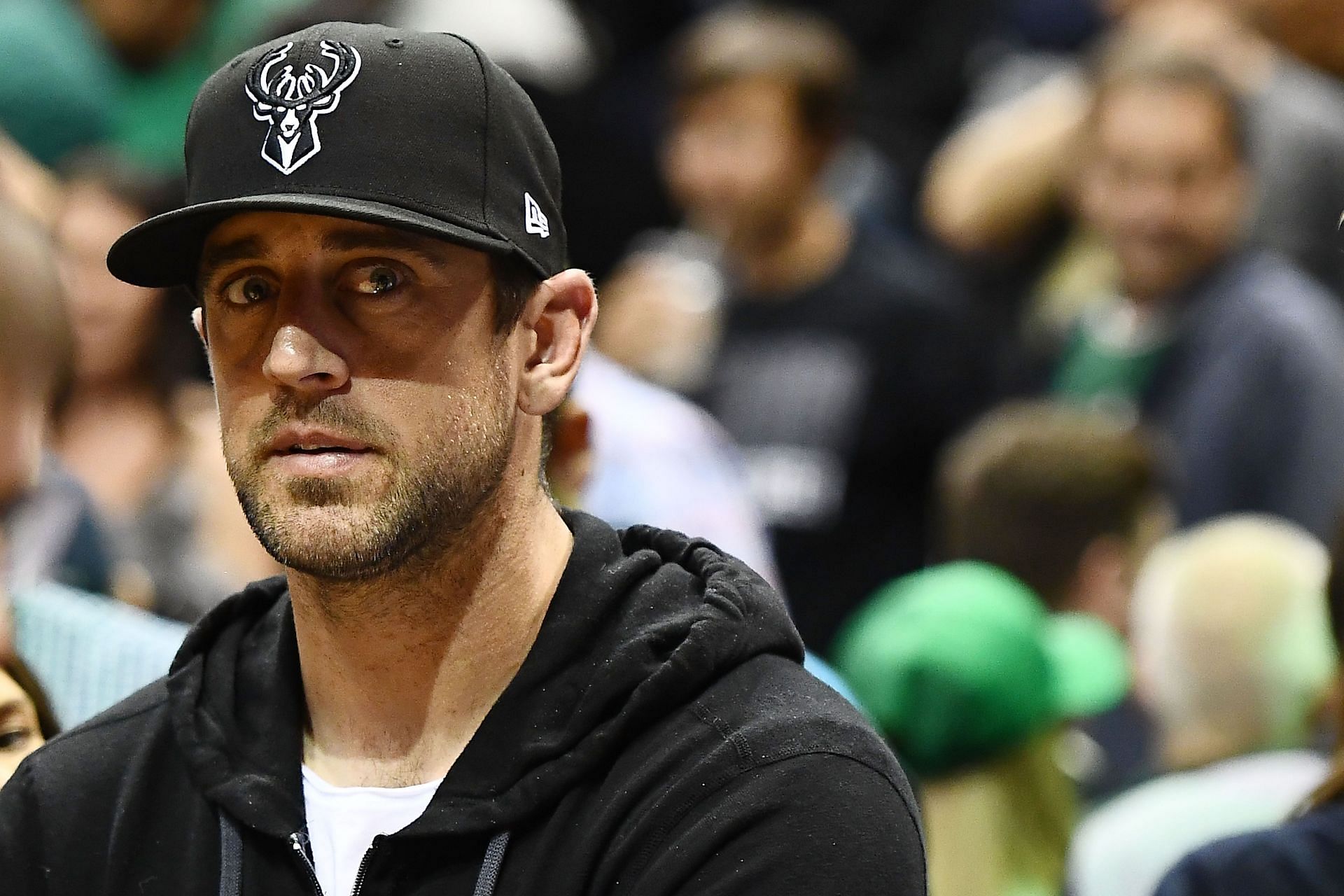 Green Bay Packers QB Aaron Rodgers attending a Bucks game