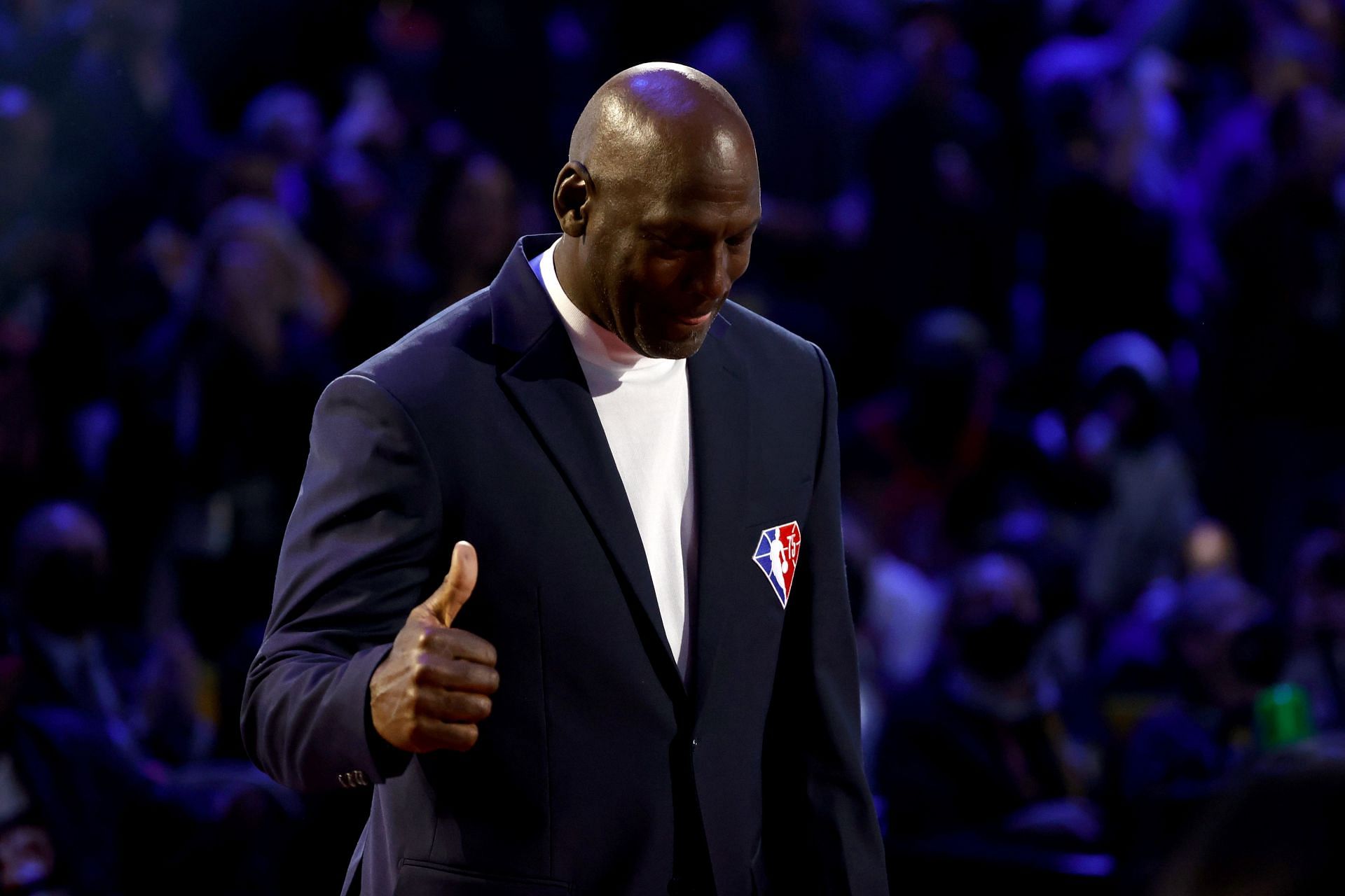 Michael Jordan reacts after being introduced as part of the NBA 75th Anniversary Team