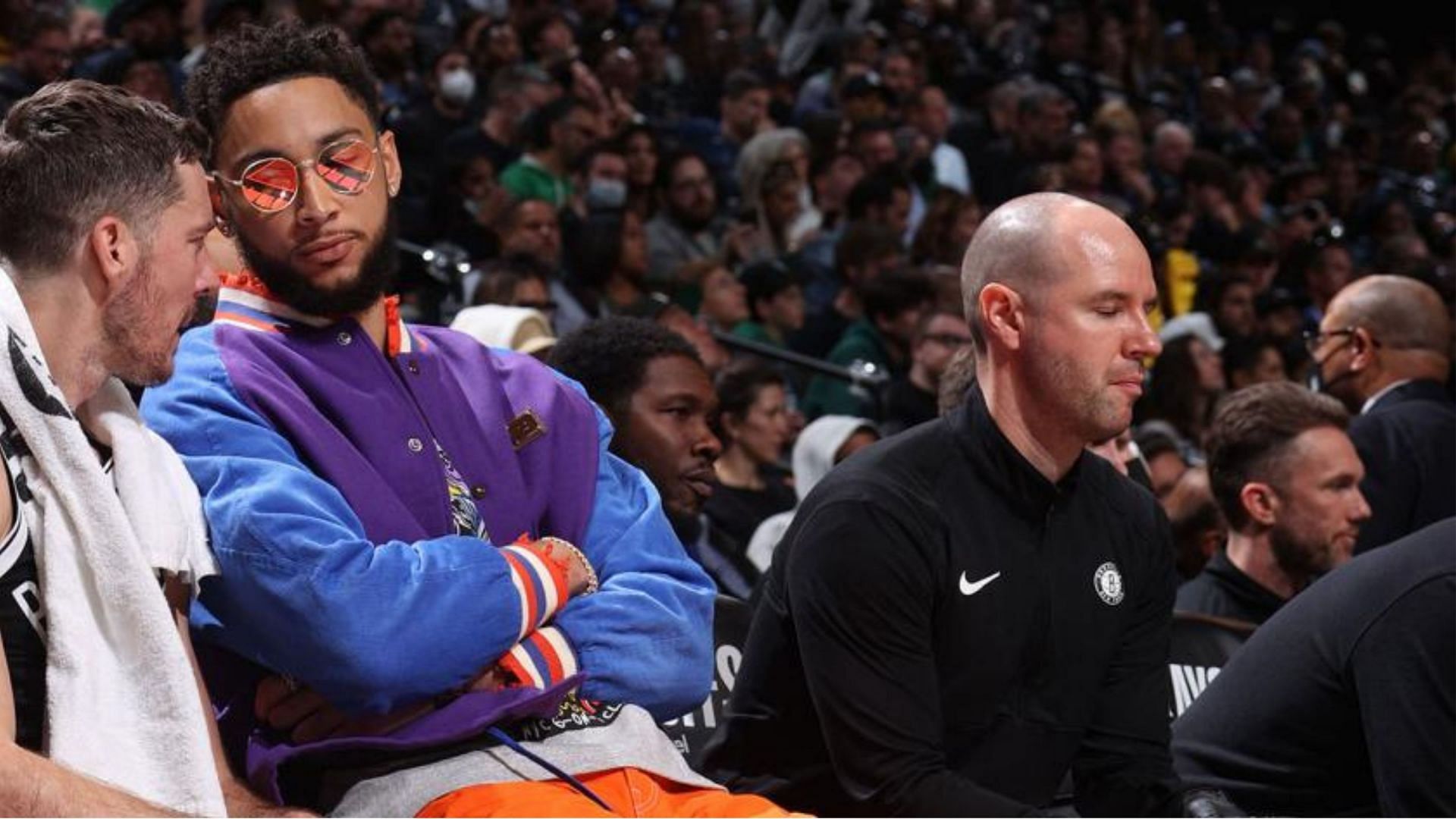 Ben Simmons watches Game 3 between the Brooklyn Nets and the Boston Celtics from the bench