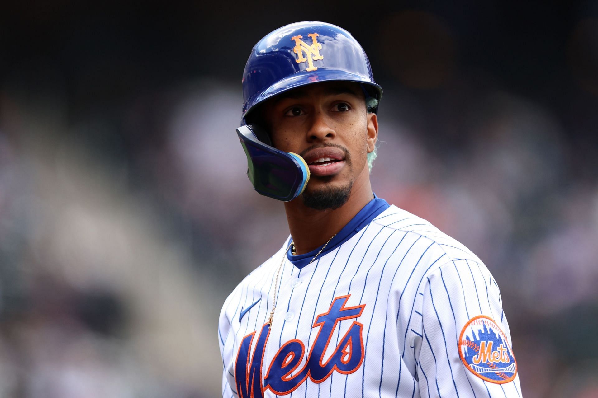 Francisco Lindor walks back to the dugout after flying out 