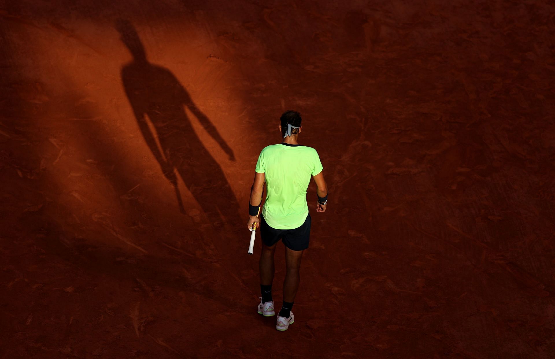 Nadal in action against Novak Djokovic at the 2021 French Open
