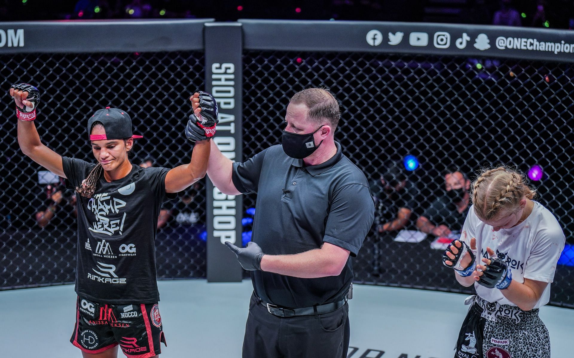 Anissa Meksen (left) gets her hand raised following her dominant unanimous decision win over Marie Ruumet (right). [Photo ONE Championship]