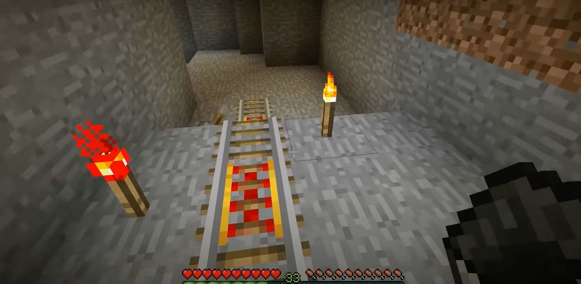 Powered rails are a great way for players to quickly increase their speed and make travel across long distances and up hills in a minecart easier (Image via Mojang Studios || William Strife/YouTube)
