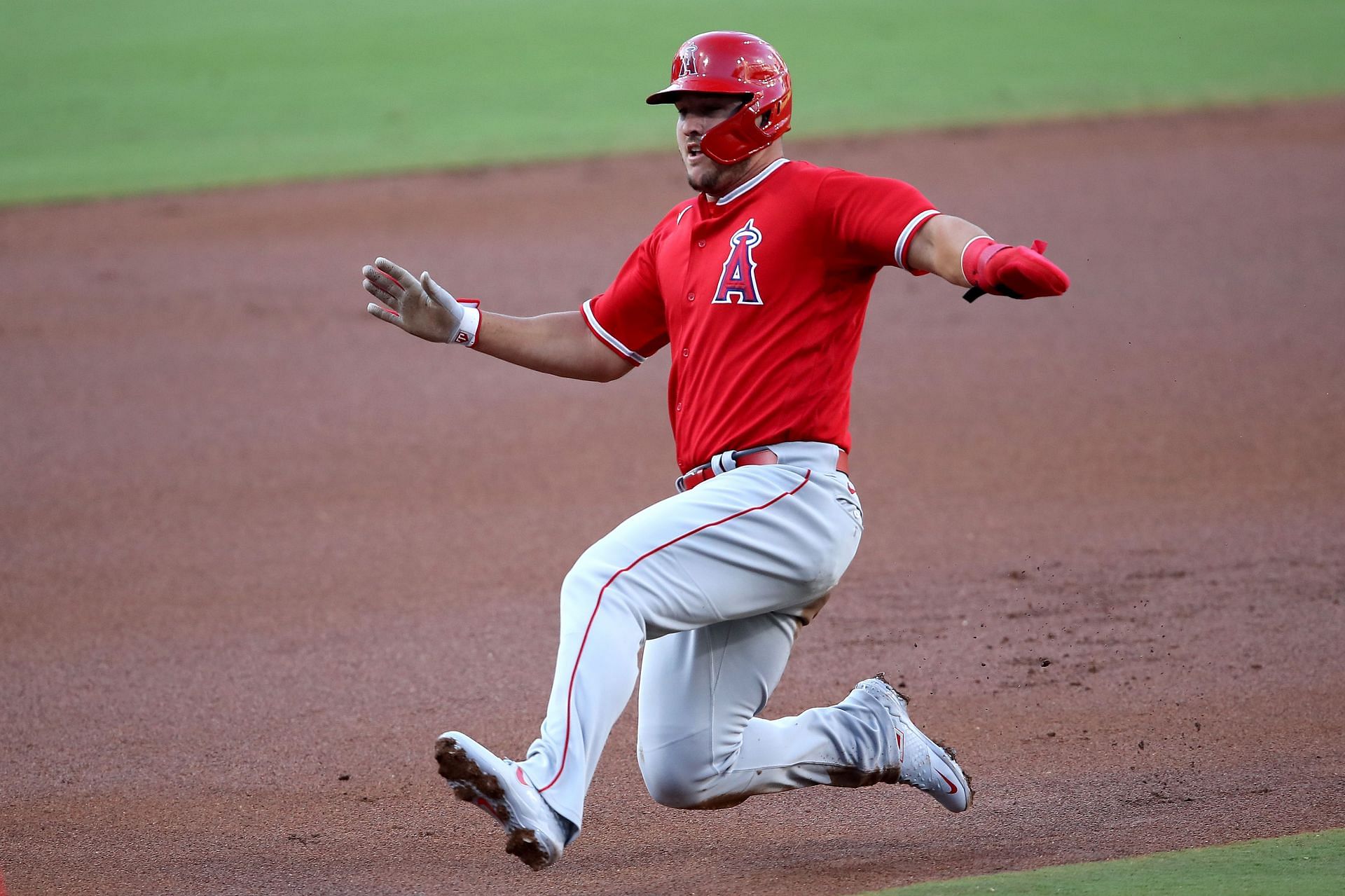 Mike Trout slides into third base