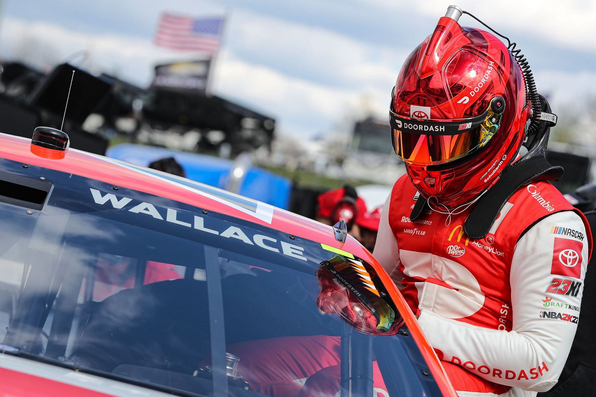 Bubba Wallace enters his car during practice for the NASCAR Cup Series Blue-Emu Maximum Pain Relief 400 at Martinsville Speedway.