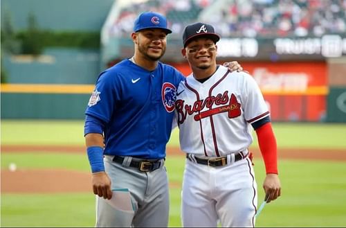 Brothers Willson Contreras (Chicago Cubs) and William Contreras (Atlanta Braves) pose for a photo after exchanging lineup cards.