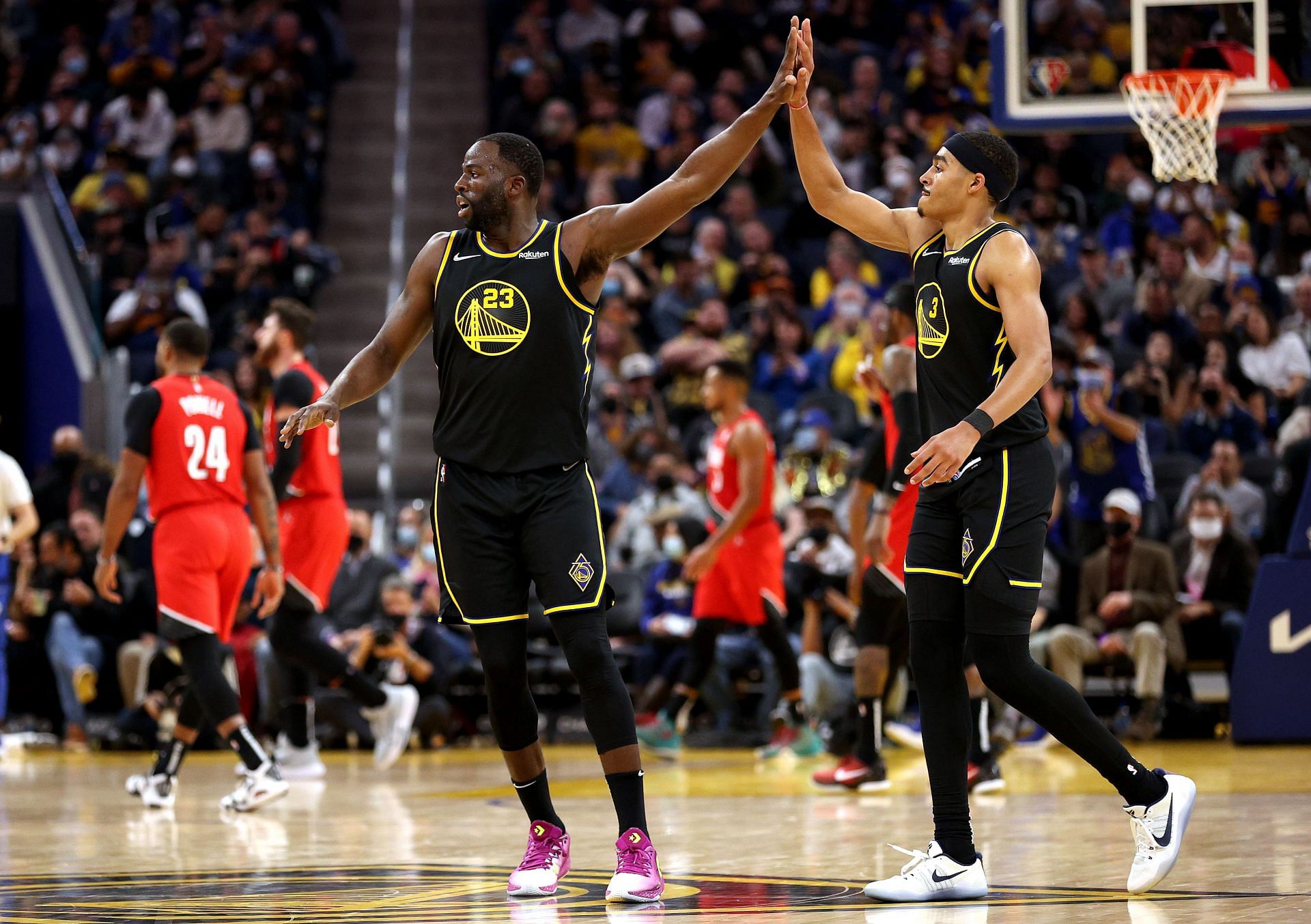 Draymond Green No. 23 and Jordan Poole No. 3 of the Golden State Warriors.