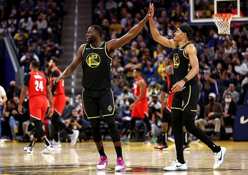 Draymond Green No. 23 and Jordan Poole No. 3 of the Golden State Warriors.