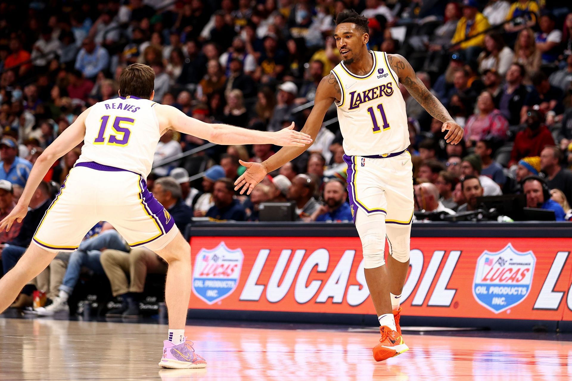 Malik Monk #11 and Austin Reaves #15 of the Los Angeles Lakers