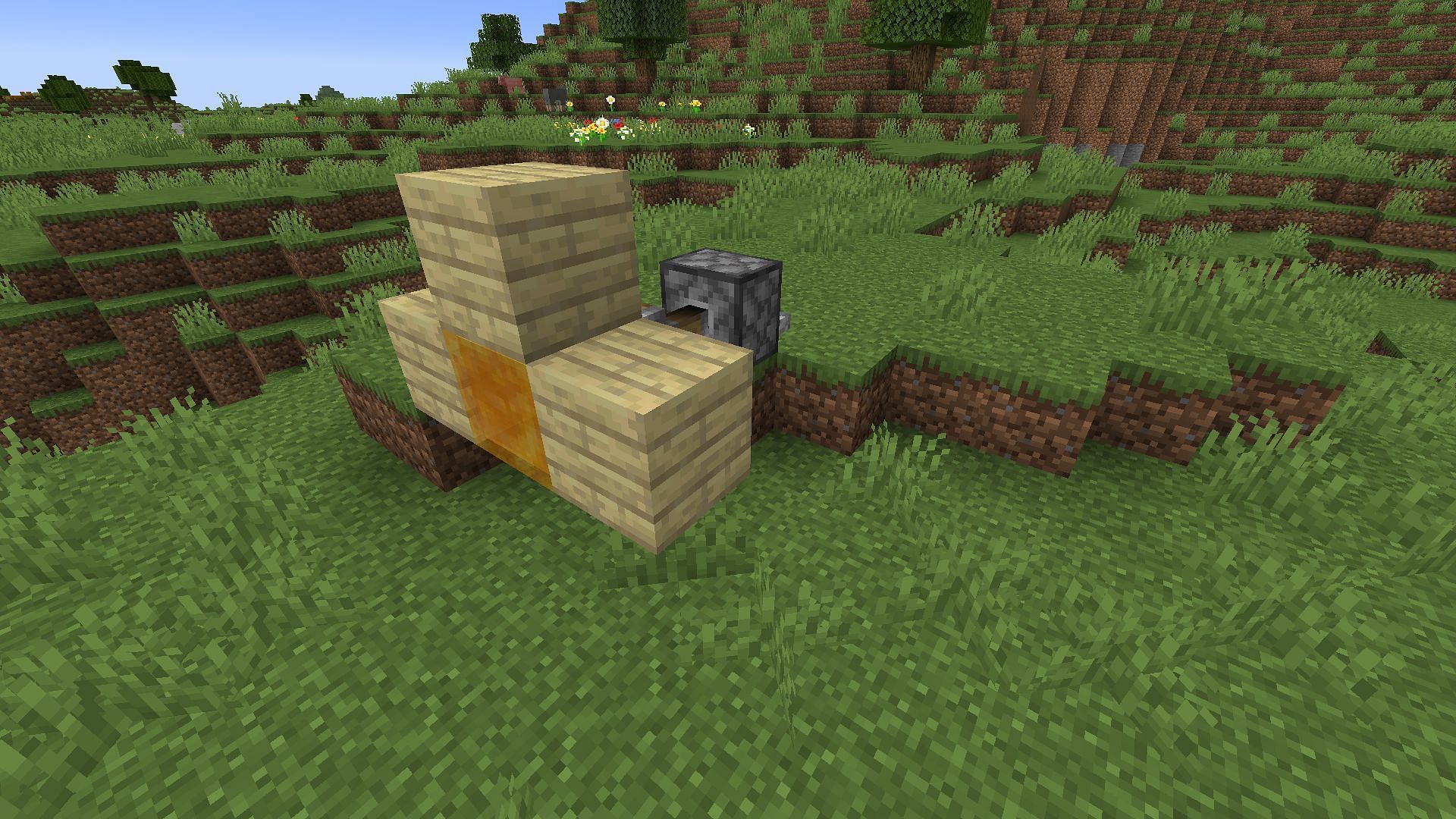 A piston moving a honey block connected to other blocks (Image via Minecraft)