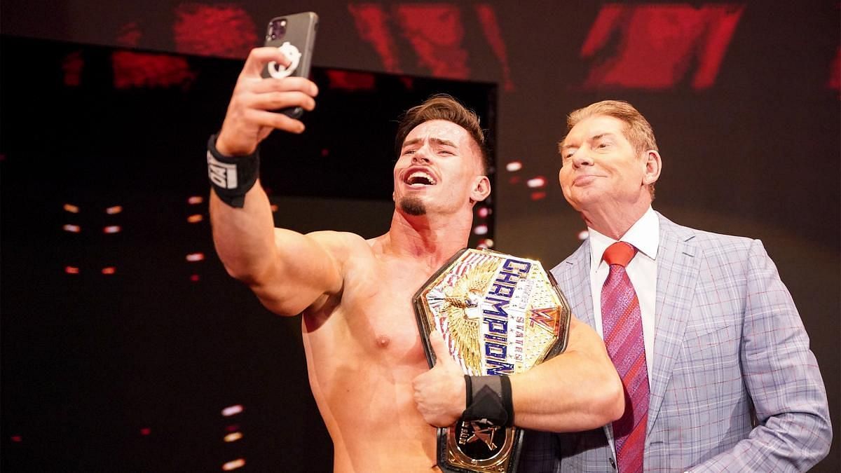Theory taking a selfie with Vince McMahon after winning the United States Championship