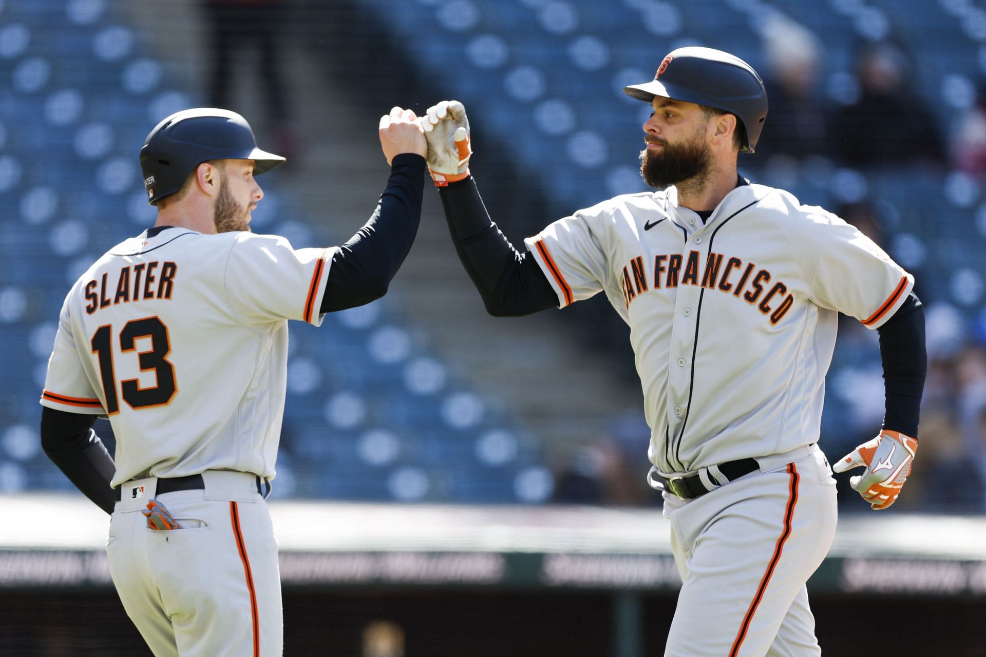 Brandon Belt celebrates with Austin Slater after hitting a two-run home run 