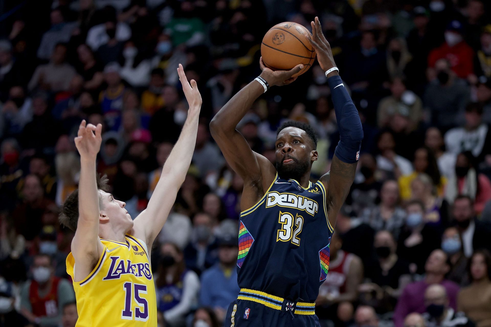 Jeff Green of the Denver Nuggets shoots against Austin Reaves of the LA Lakers.