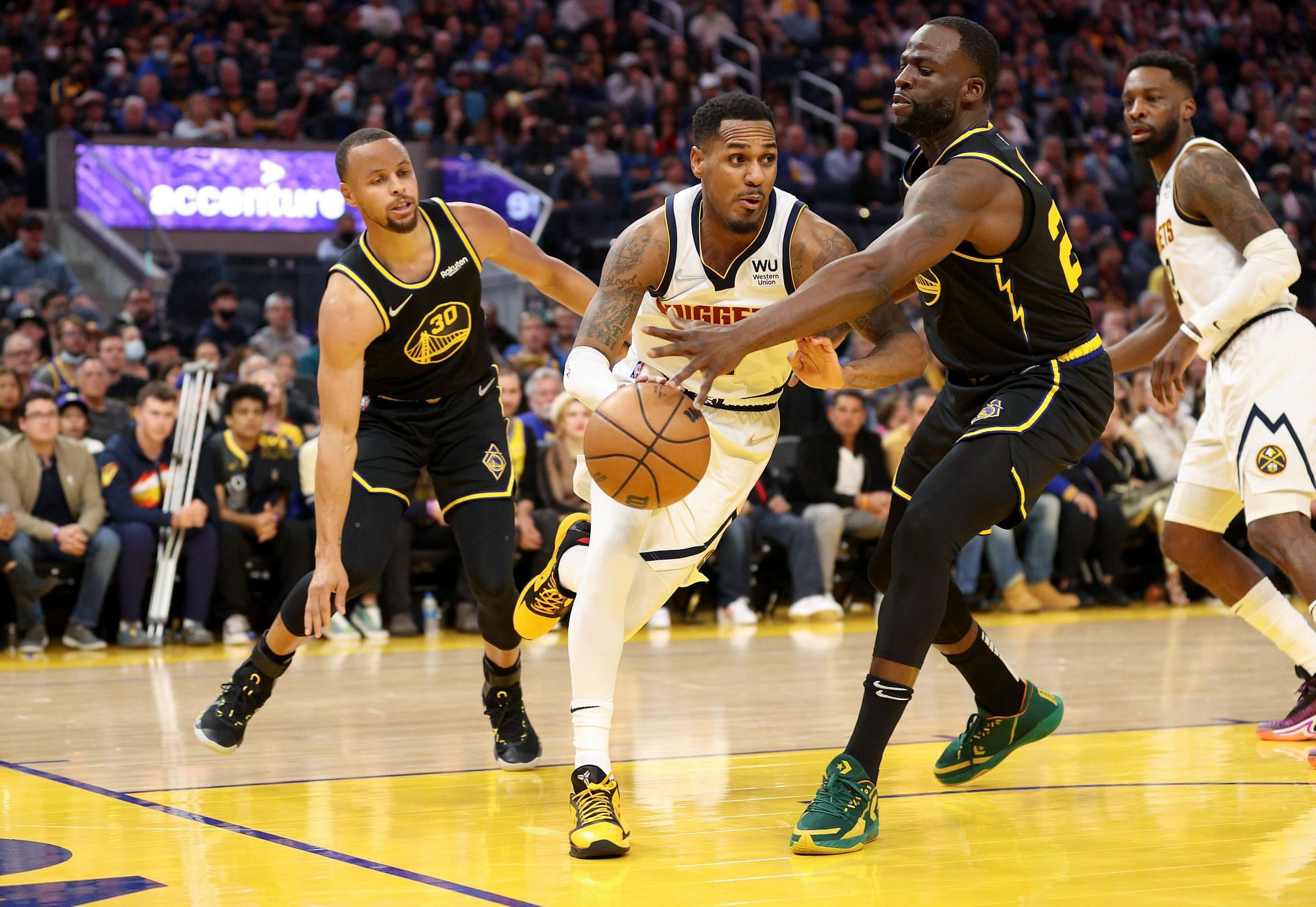 Steph Curry and Draymond Green in action.