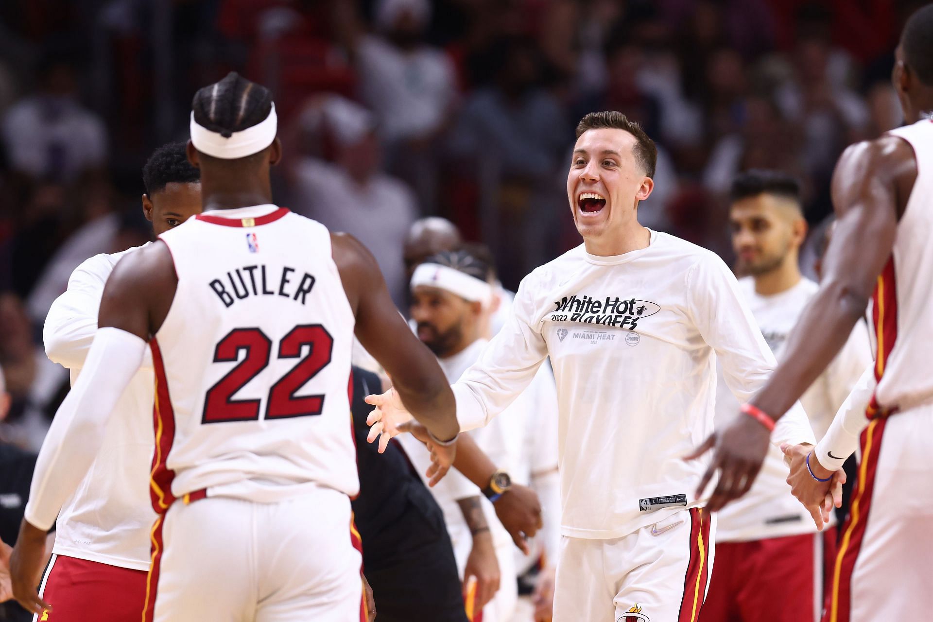 Duncan Robinson #55 of the Miami Heat celebrates with Jimmy Butler #22