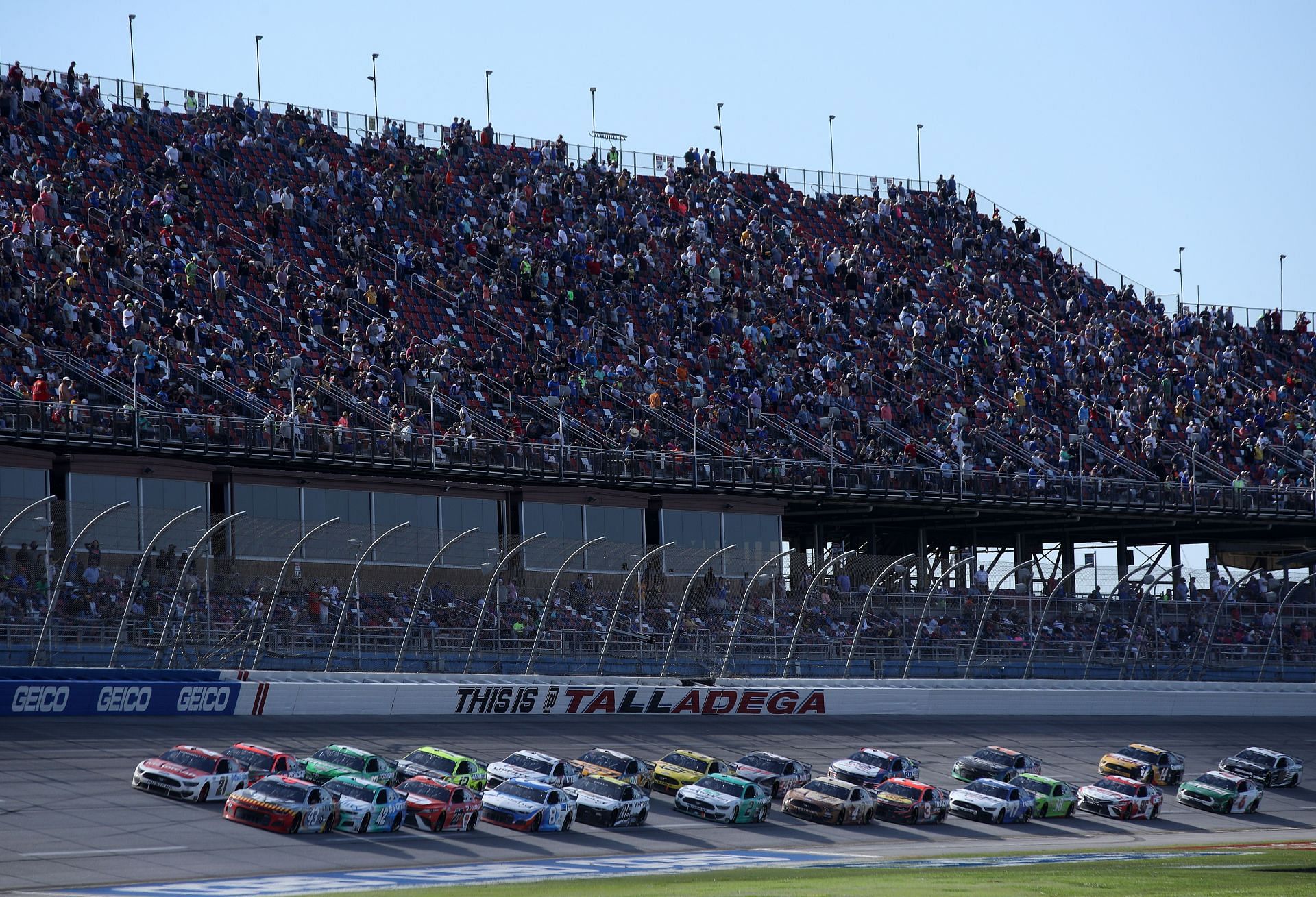 Cars race during the 2021 NASCAR Cup Series GEICO 500 at Talladega Superspeedway in Alabama. (Photo by Sean Gardner/Getty Images)