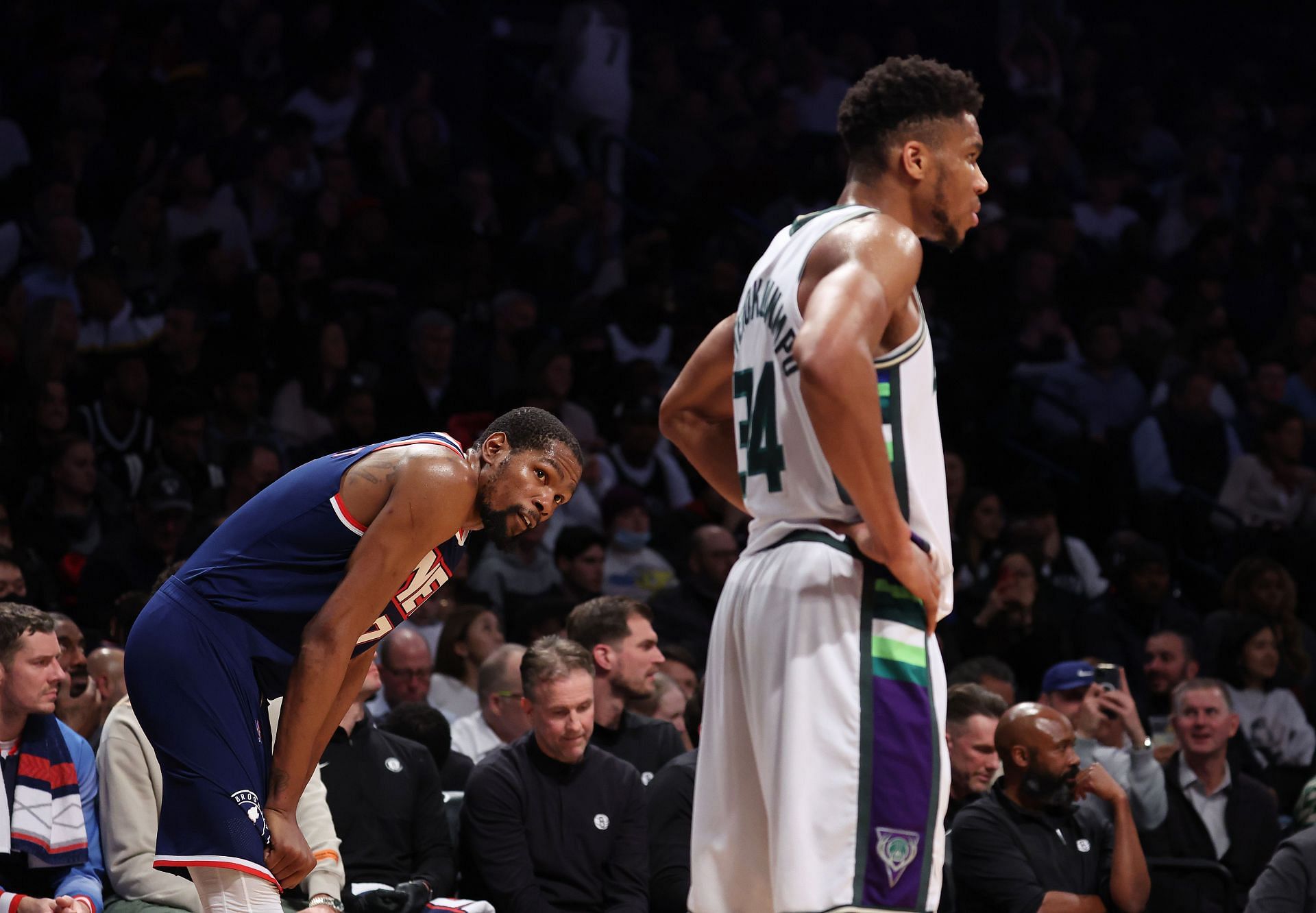 Kevin Durant (L) and Giannis Antetokounmpo (R) in action during Milwaukee Bucks v Brooklyn Nets
