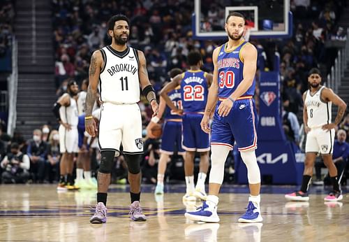 Kyrie Irving and Steph Curry during the Brooklyn Nets v Golden State Warriors game earlier in the season