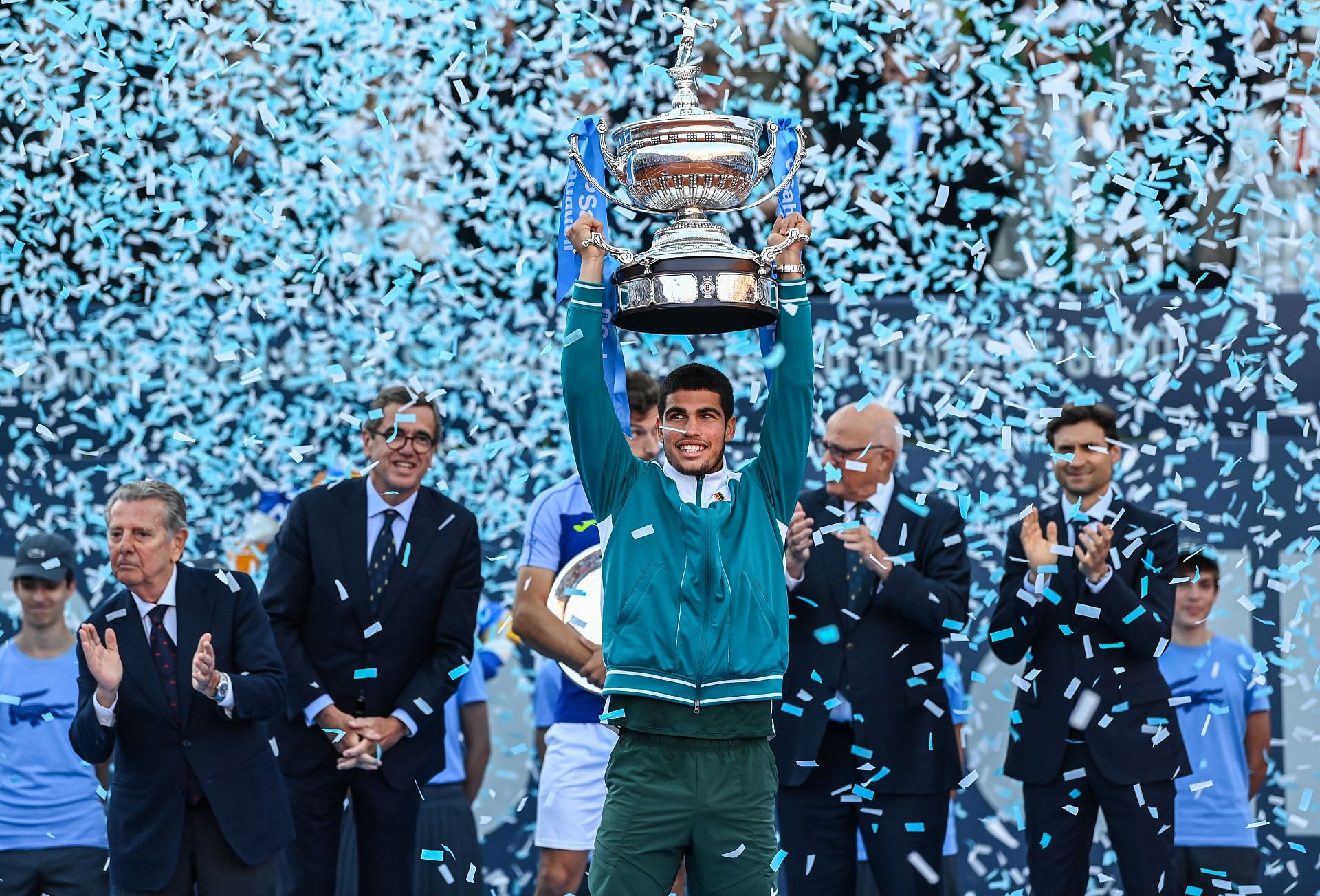 Carlos Alcaraz raises his third trophy of the season after defeating Pablo Carre&ntilde;o Busta, 6-3, 6-2, in Barcelona.