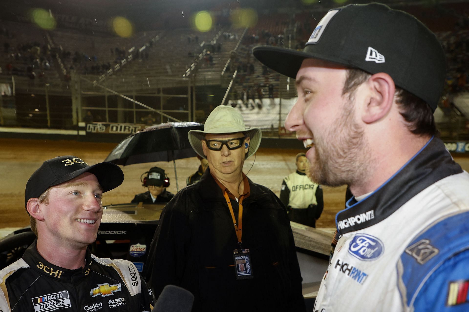 Tyler Reddick and Chase Briscoe talk after an on-track incident during the 2022 NASCAR Cup Series Food City Dirt Race at Bristol Motor Speedway in Tennessee. (Photo by Chris Graythen/Getty Images)