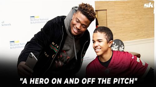 Pittsburgh Steelers QB Dwayne Haskins and a young student