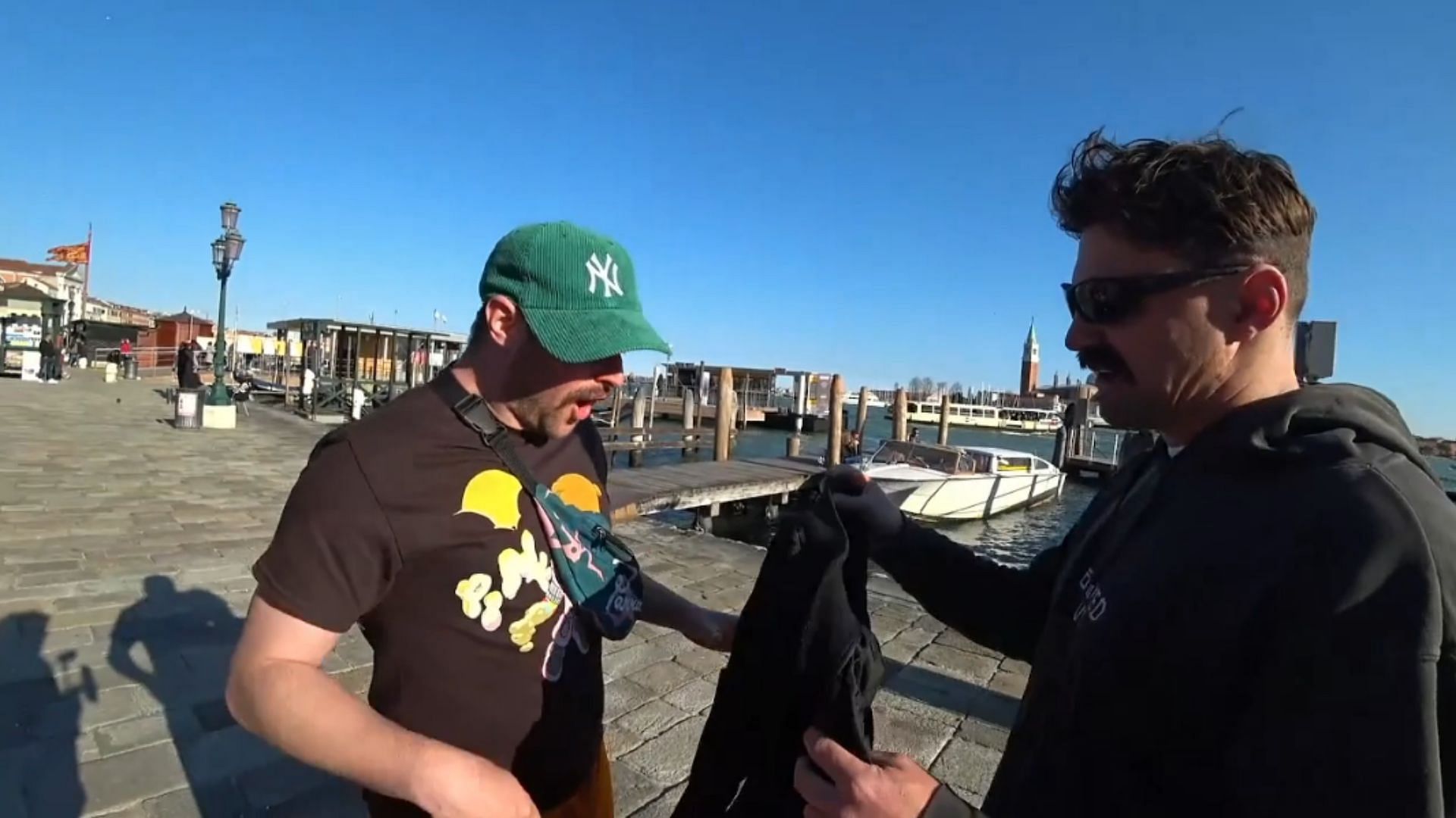 The Wonton Don hands over a Primark jacket to a very shocked Rich Campbell (Image via Twitch/AndyMilonakis)