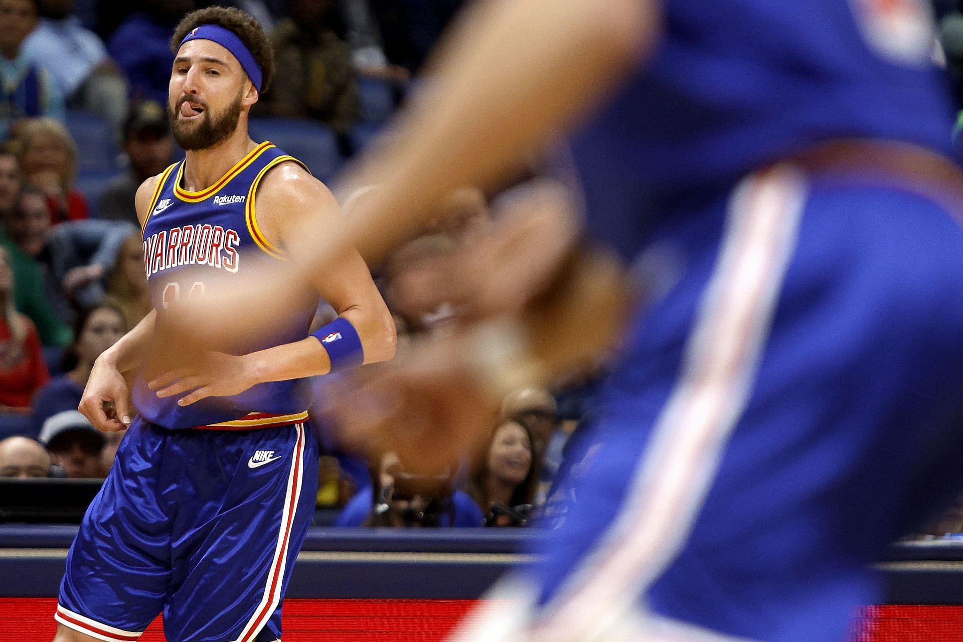 Klay Thompson #11 of the Golden State Warriors reacts after scoirng a three point basket during the fourth quarter of an NBA game against the New Orleans Pelicans at Smoothie King Center on April 10, 2022 in New Orleans, Louisiana.