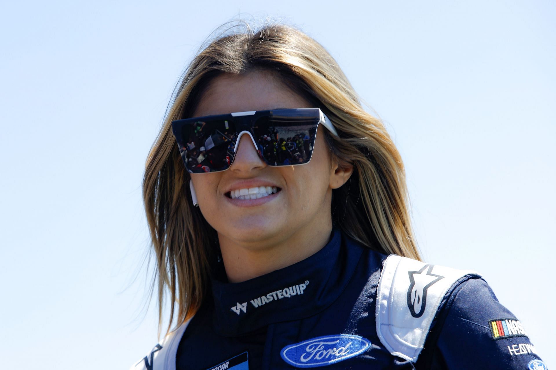 Hailie Deegan walks onstage during driver intros prior to the NASCAR Camping World Truck Series Fr8 208 at Atlanta Motor Speedway.