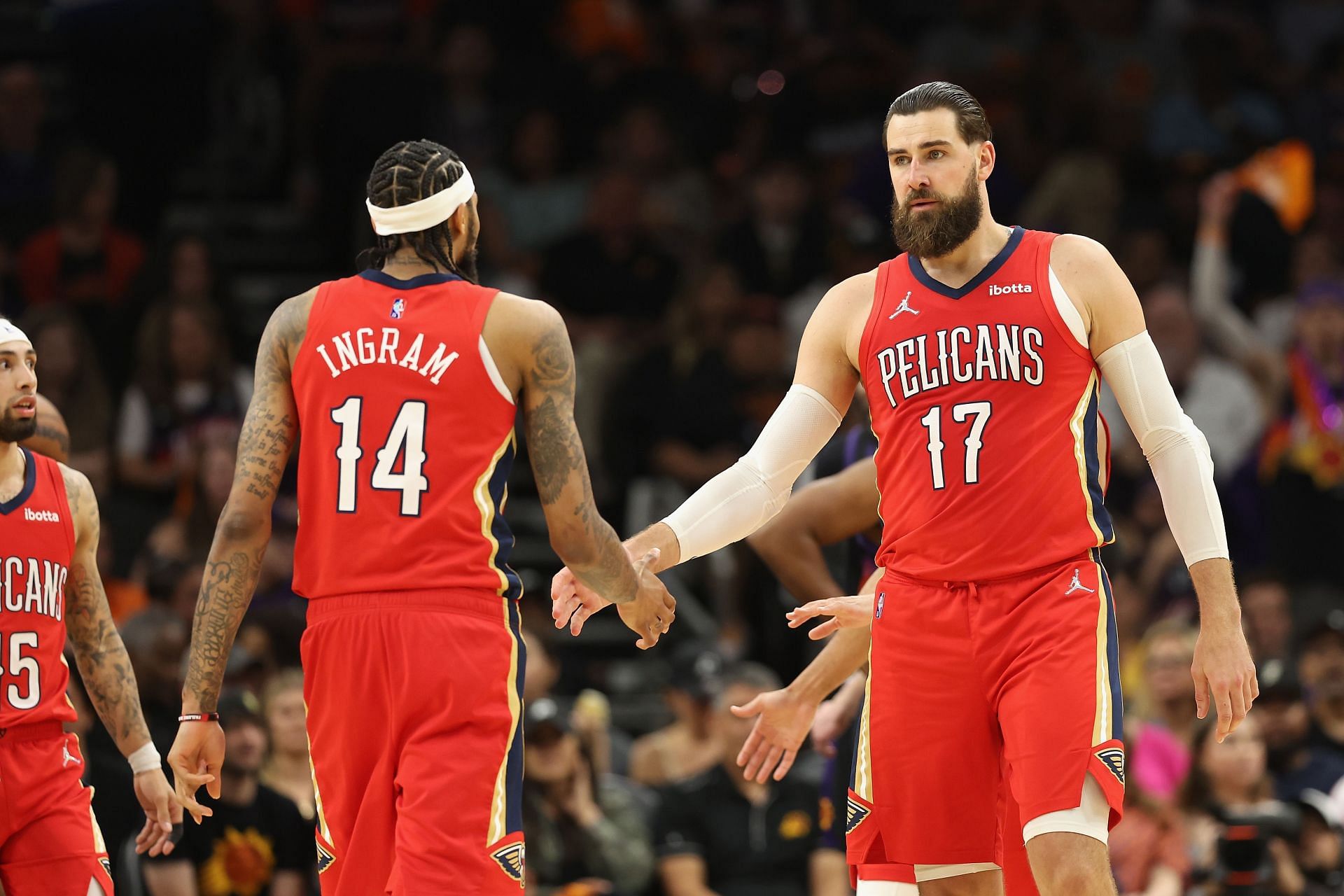 Brandon Ingram and Jonas Valanciunas celebrate a play