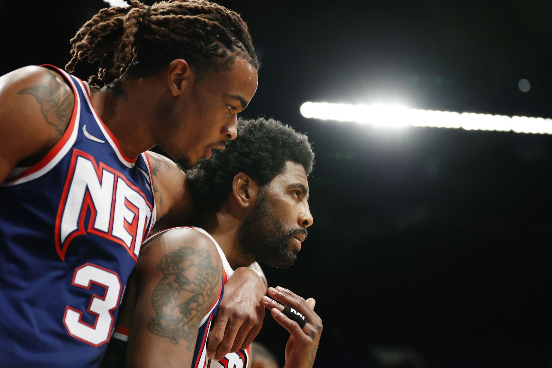 Kyrie Irving #11 reacts with Nic Claxton #33 of the Brooklyn Nets during the first half against the Indiana Pacers at Barclays Center on April 10, 2022 in the Brooklyn borough of New York City.