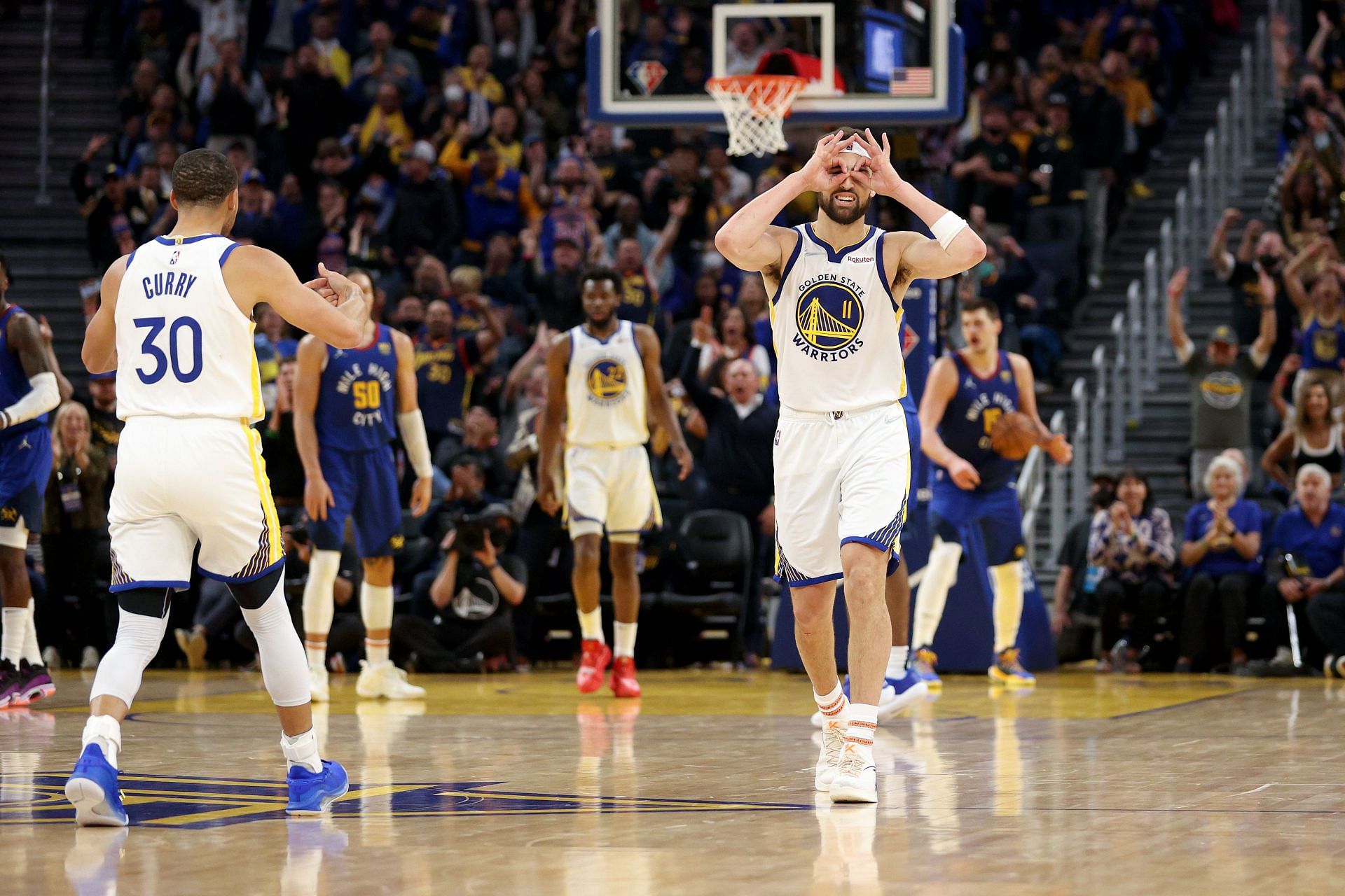 Klay Thompson of the Golden State Warriors reacts after Steph Curry made a 3-pointer.
