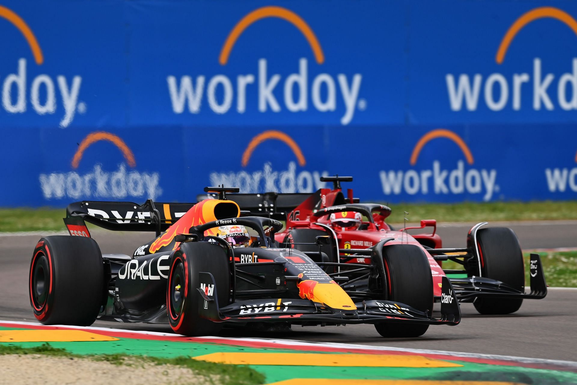 F1 Grand Prix of Emilia Romagna - Sprint - Max Verstappen (foreground) gets the move done on Charles Leclerc (background)
