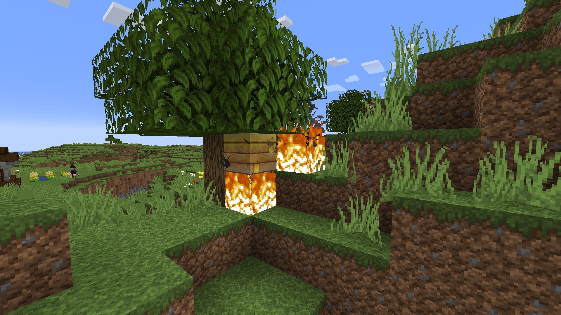 Fire being used to keep bees calm (Image via Minecraft)