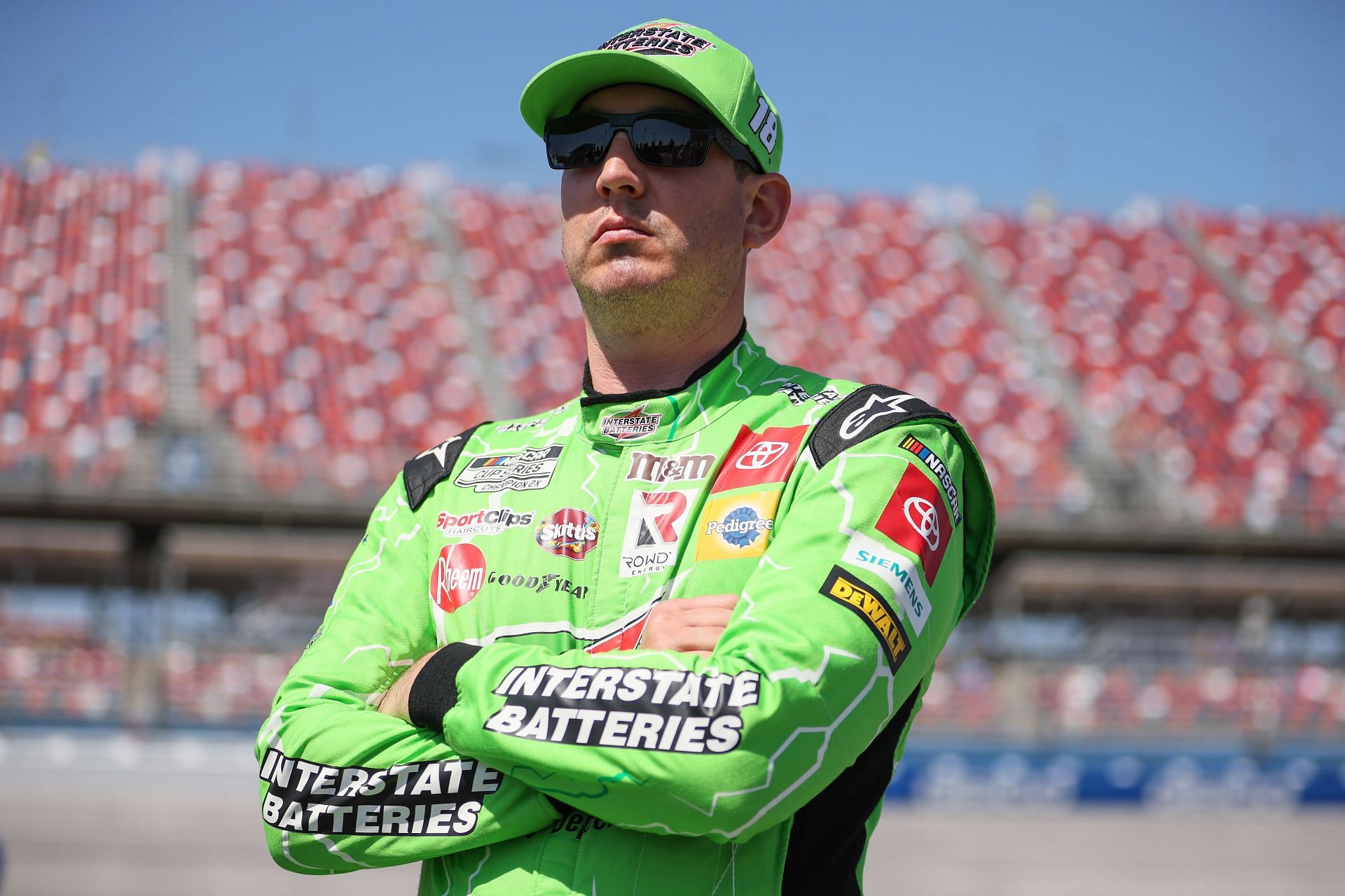 Kyle Busch looks on during qualifying for the NASCAR Cup Series GEICO 500 at Talladega Superspeedway.