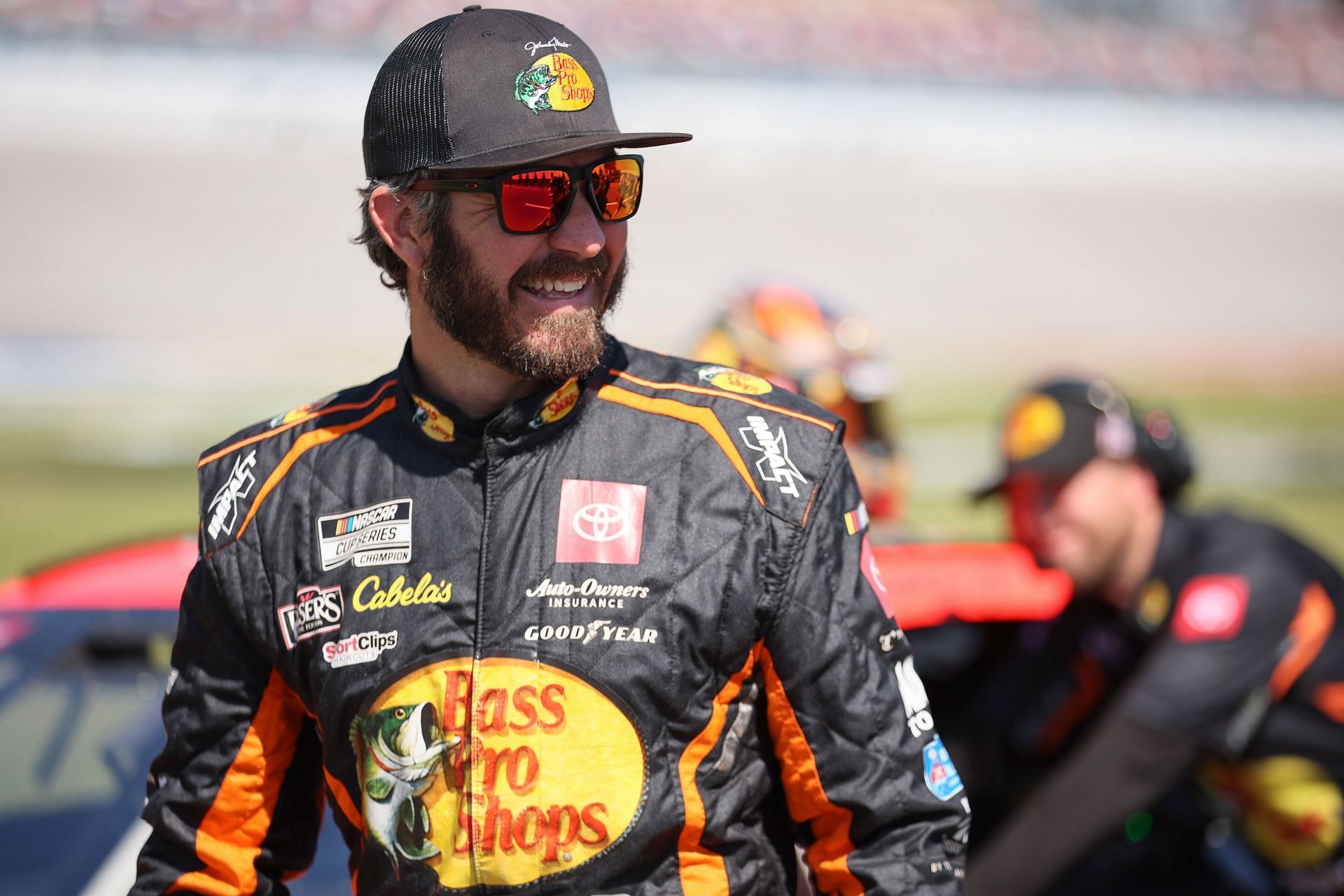 Martin Truex Jr. walks the grid during qualifying for the NASCAR Cup Series GEICO 500 at Talladega Superspeedway.