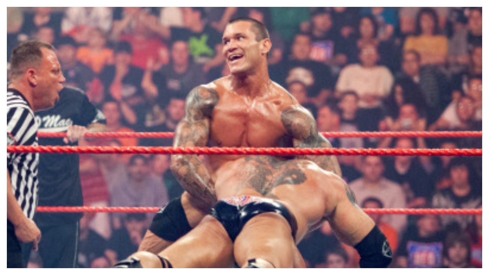 The Viper executes a draping DDT on Batista