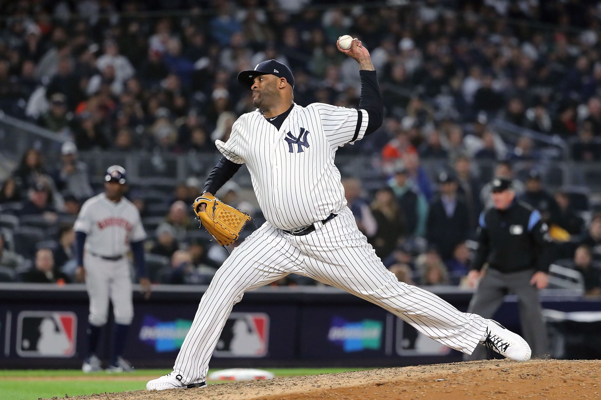 C.C. Sabathia #52 of the New York Yankees delivers the pitch against the Houston Astros.